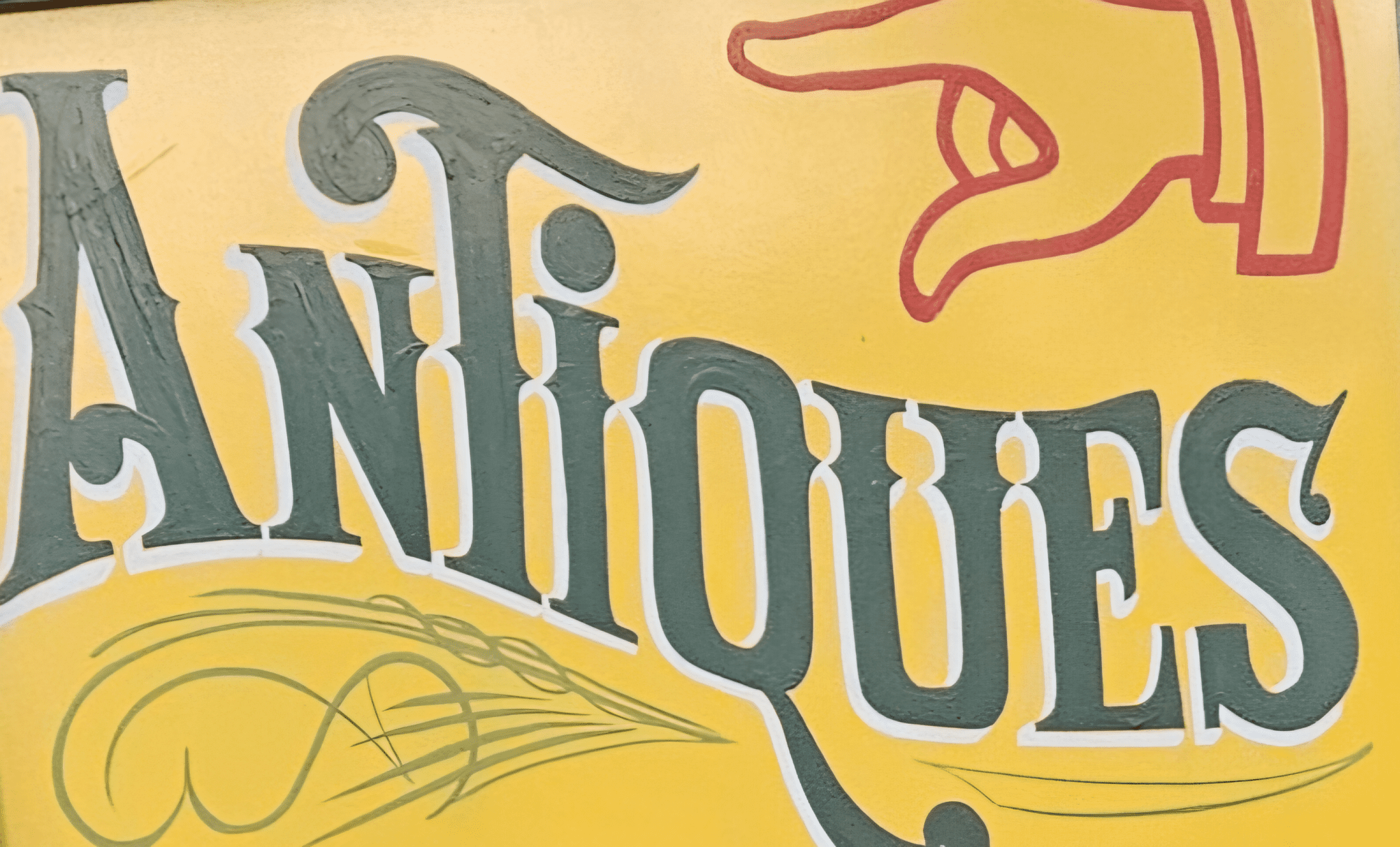 Antiques sign in front of Jefferson Street antiques. by Chastity